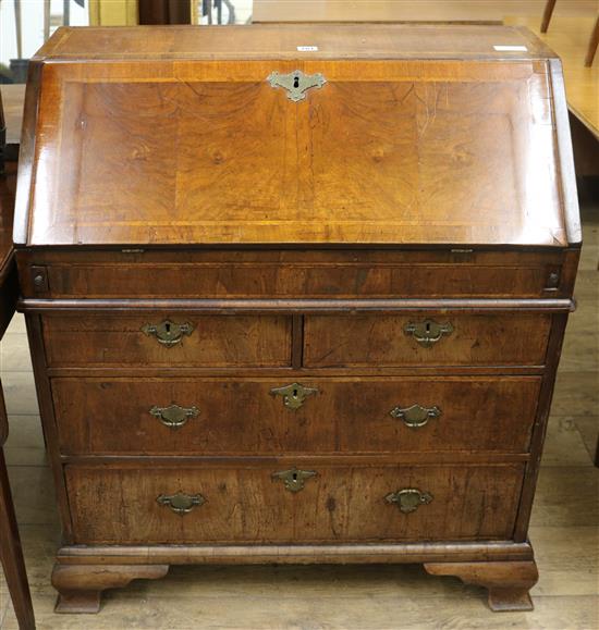 A Queen Anne and later featherbanded walnut bureau W.90cm